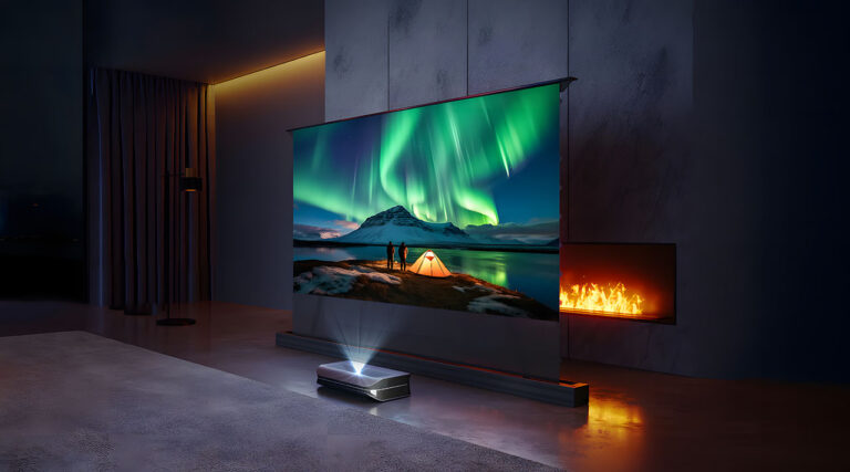 Home theater with a projector screen showing an aurora over a tent and snowy mountain.